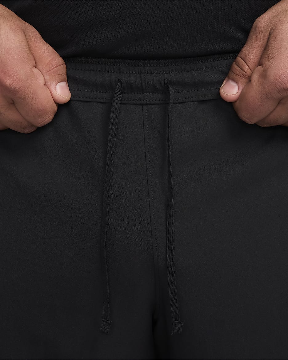 Nike running woven sweatpants in black sale